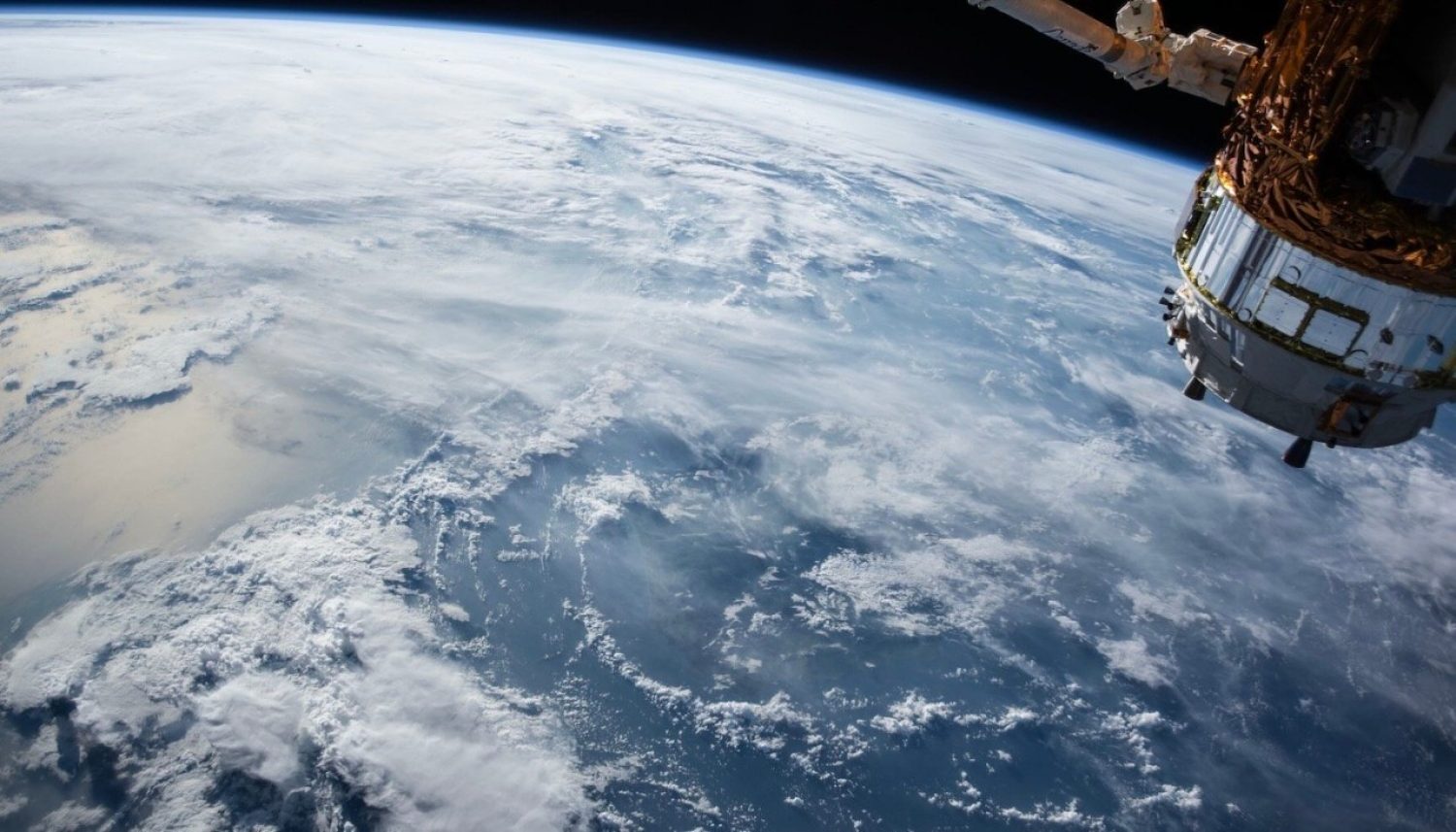 A view of Earth and the International Space Station from outer space