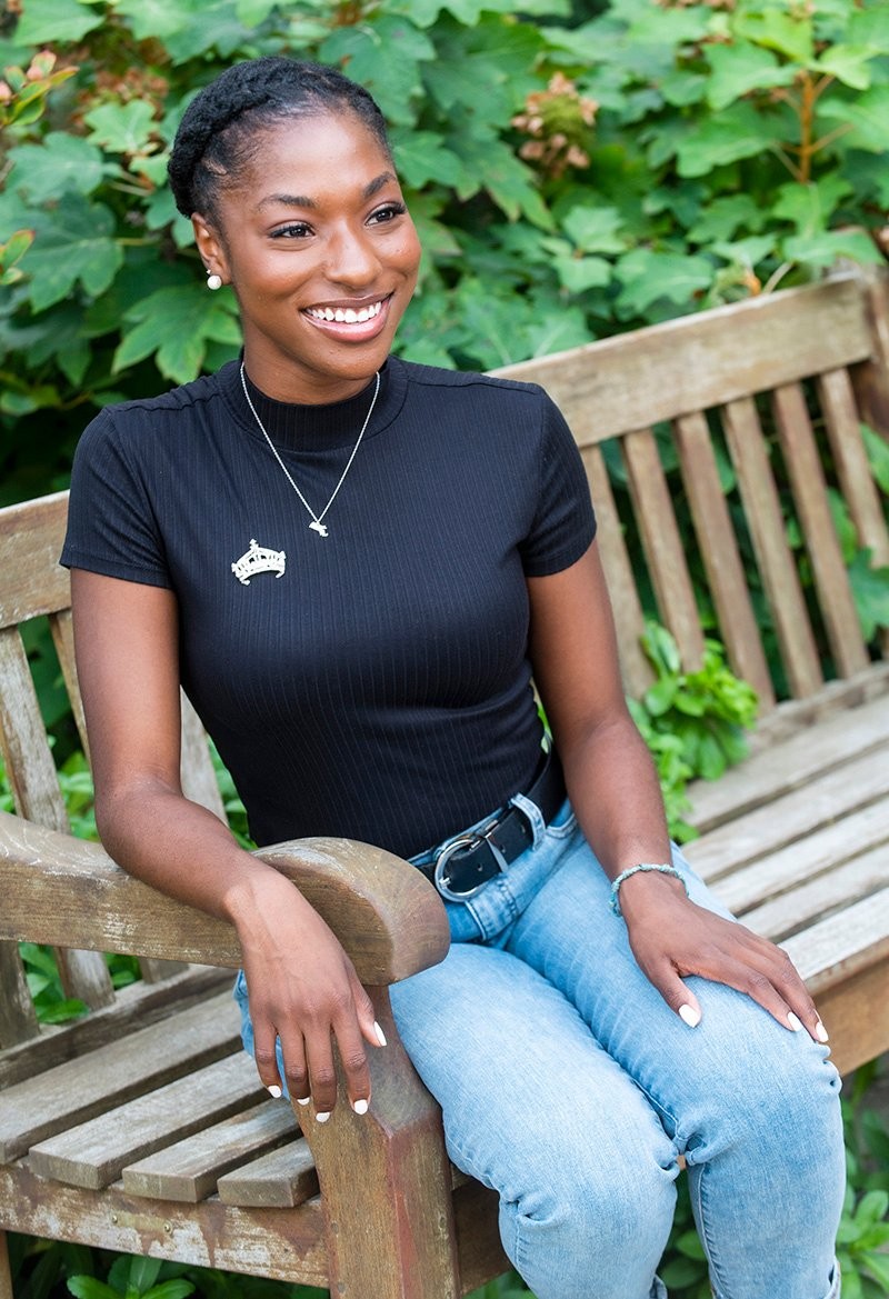 Elizabeth Pierre sitting on a bench