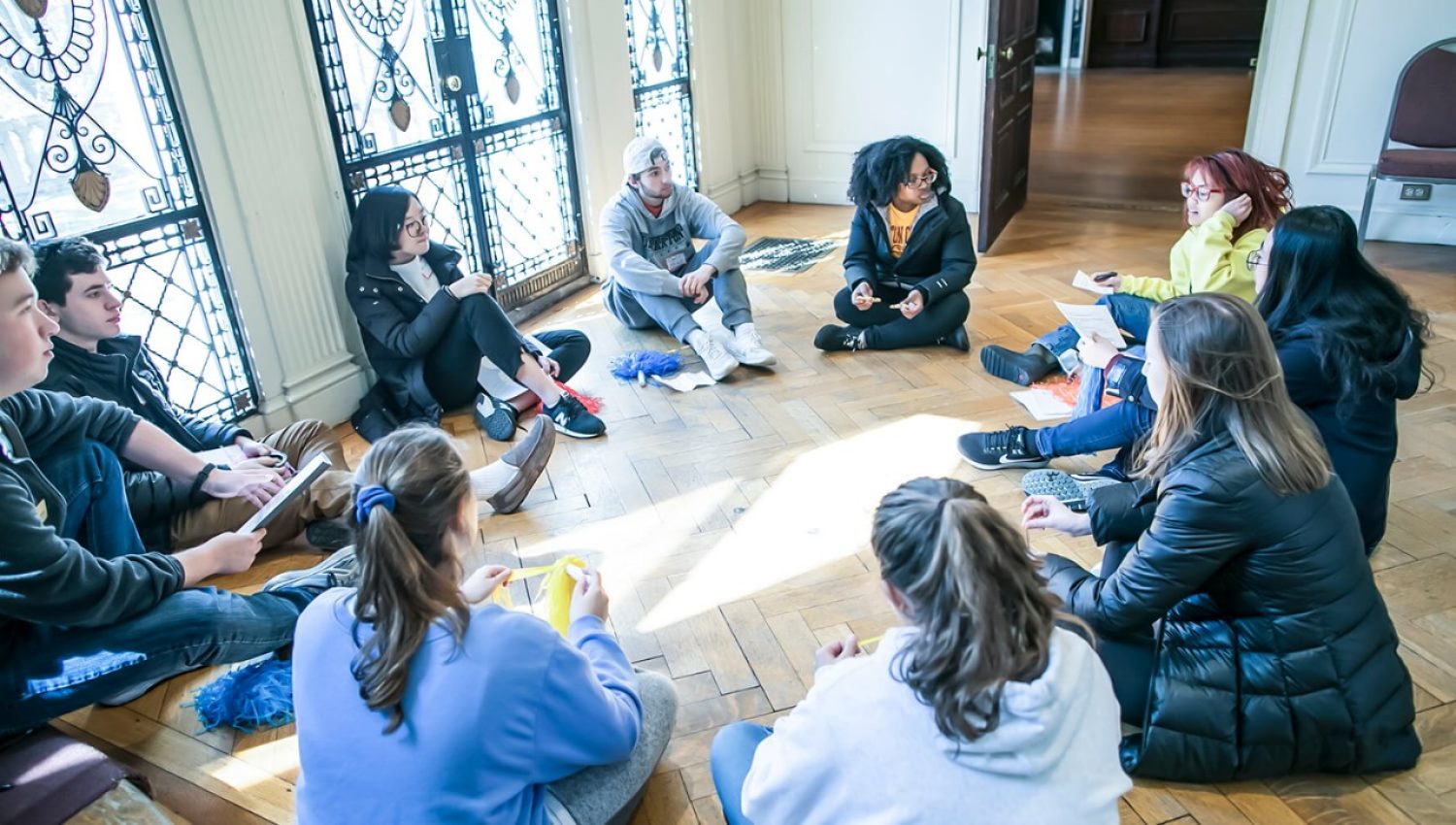 Students sit in a circle during 2018 'Envision' program