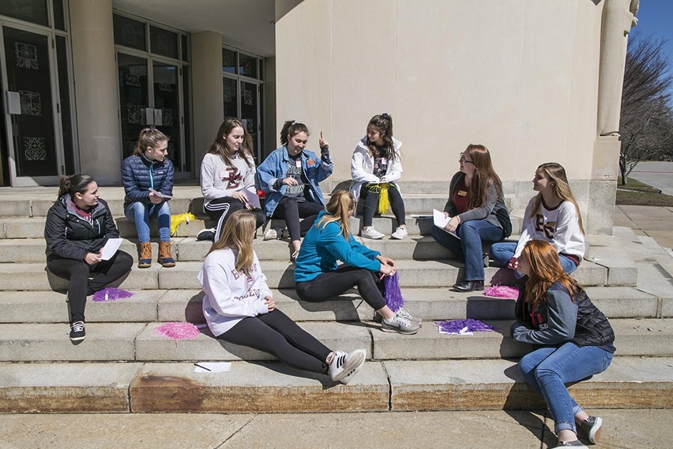 Students sit outside during 2018 'Envision' program