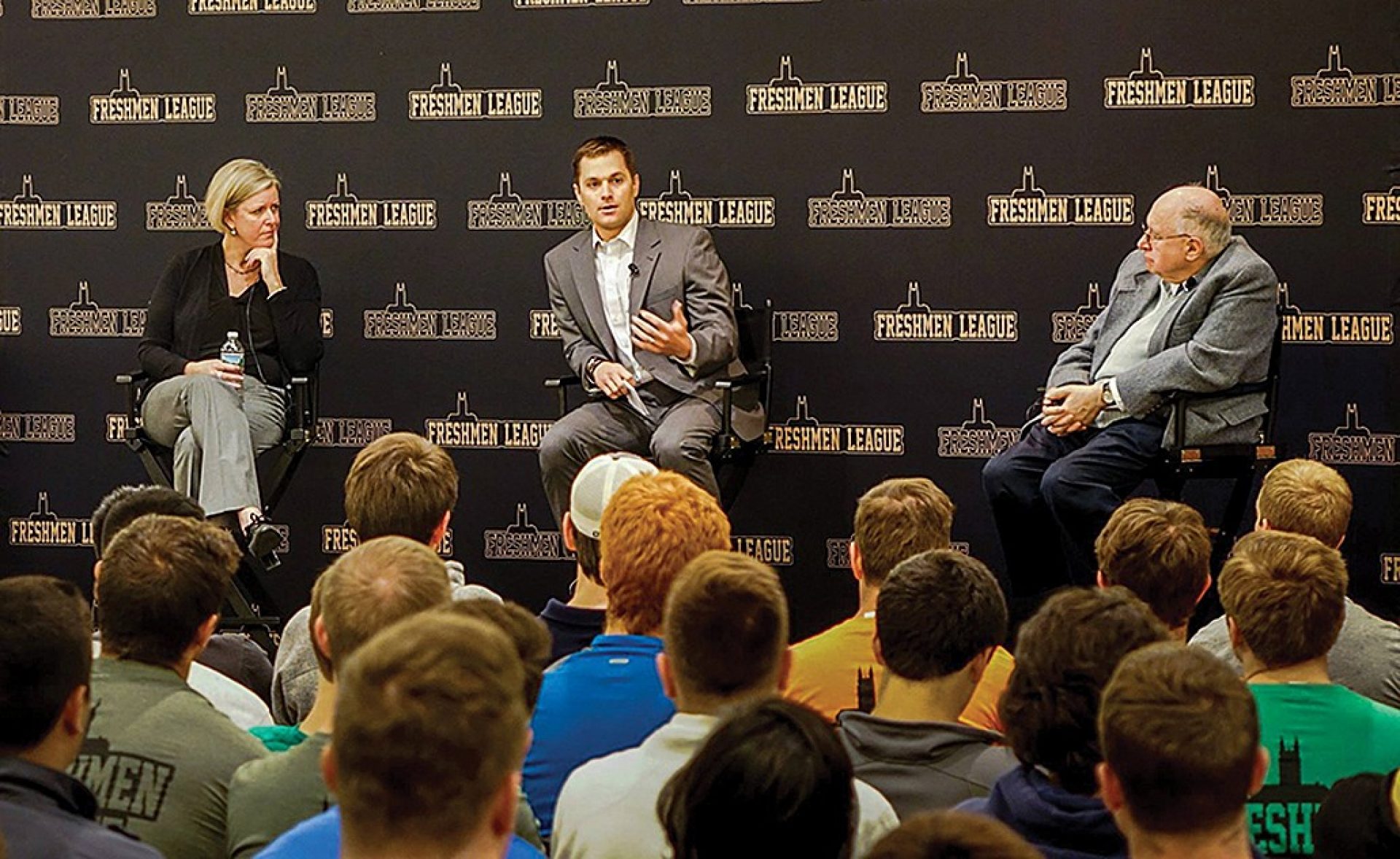 U.S. Navy Lt. Dave Dauphinais '05, center, joined Professor of Theology Rev. Michael Himes and Lonergan Institute Associate Director Kerry Cronin at a Freshman League event.