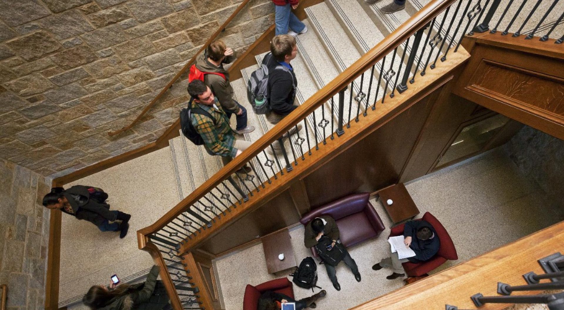 overhead view of a student taking notes in class