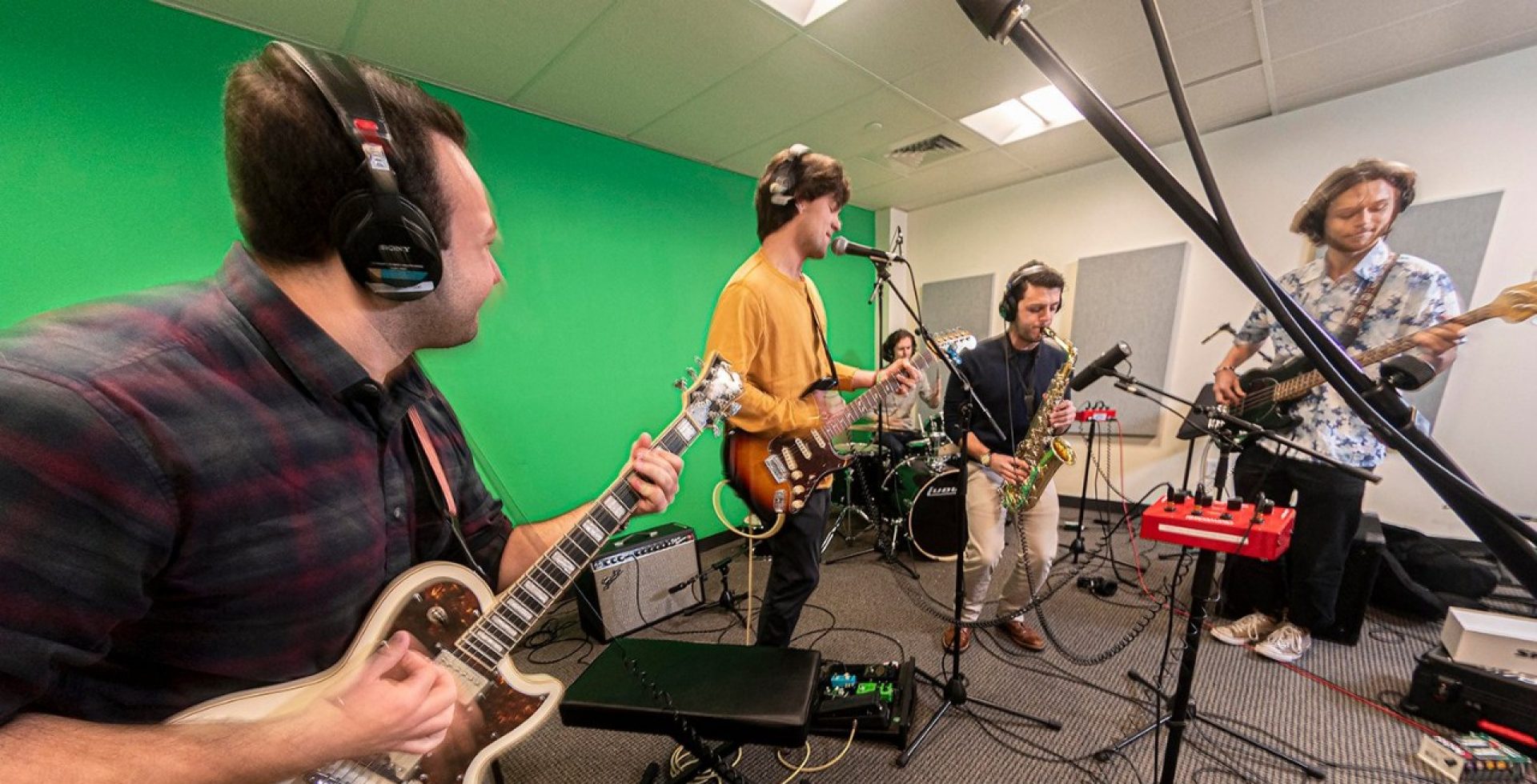 A band playing in a green room