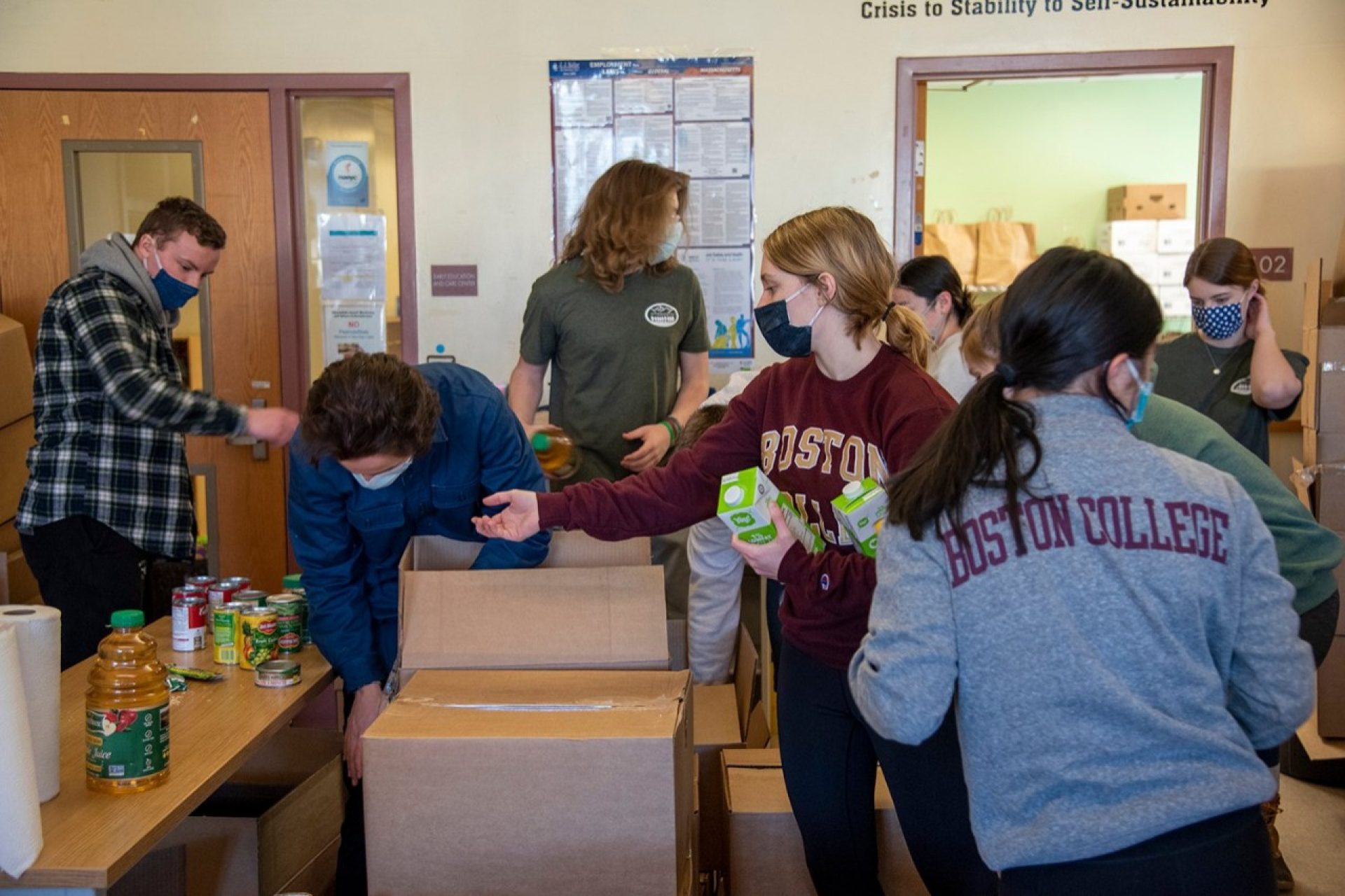 A group of students packing boxes