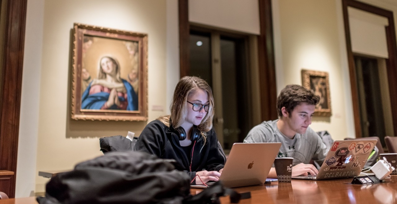 Morrissey College of Arts & Sciences students Ava Schiebler '20 and Harry Townsend '19 make use of the McMullen Museum of Art during study days. 