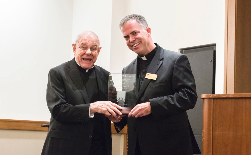 Padberg-and-Beaumier-1030 John W. Padberg, S.J., at left, is presented with the George Ganss, S.J. Award by Casey Beaumier, S.J., director of the Institute for Advanced Jesuit Studies at Boston College. (Gary Wayne Gilbert)