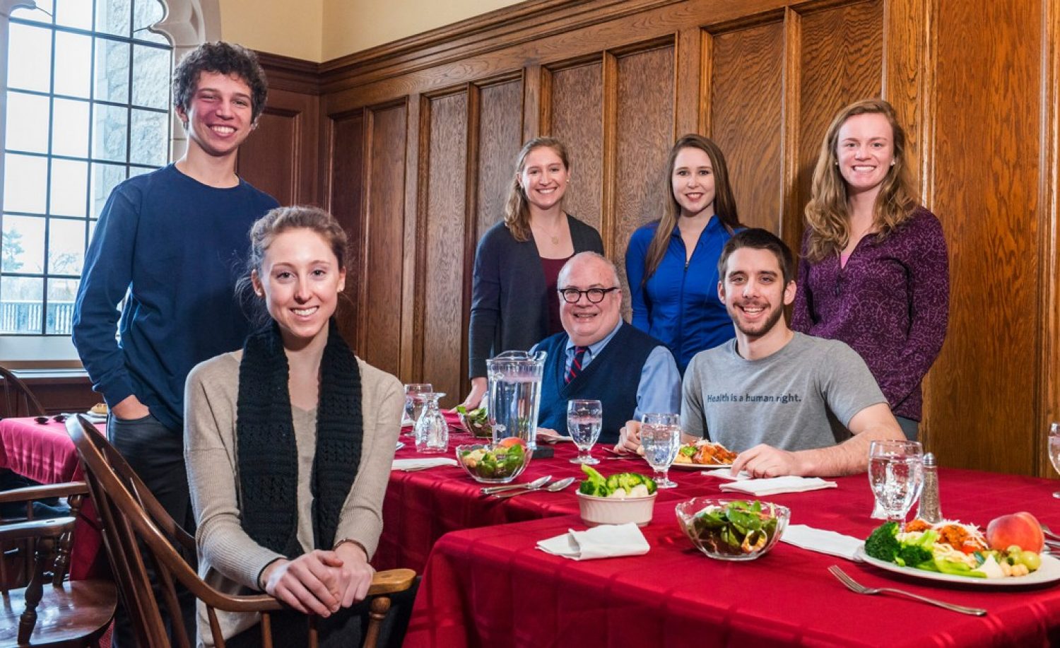 A group of BC undergraduates with Fr. Mark Massa, S.J., at a "Lunches with Jesuits" event