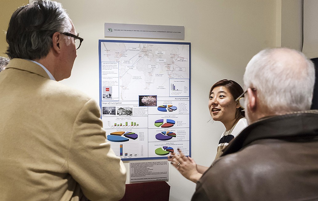 Suhee Vesper Yun '18, above, and George Boateng '18 described their projects at the opening of "Righting Historical Wrongs at the Turn of the Millennium," the latest exhibit in the "Making History Public" series.