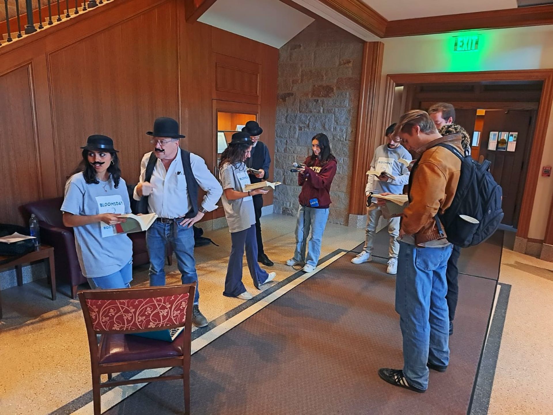 students standing and reading aloud