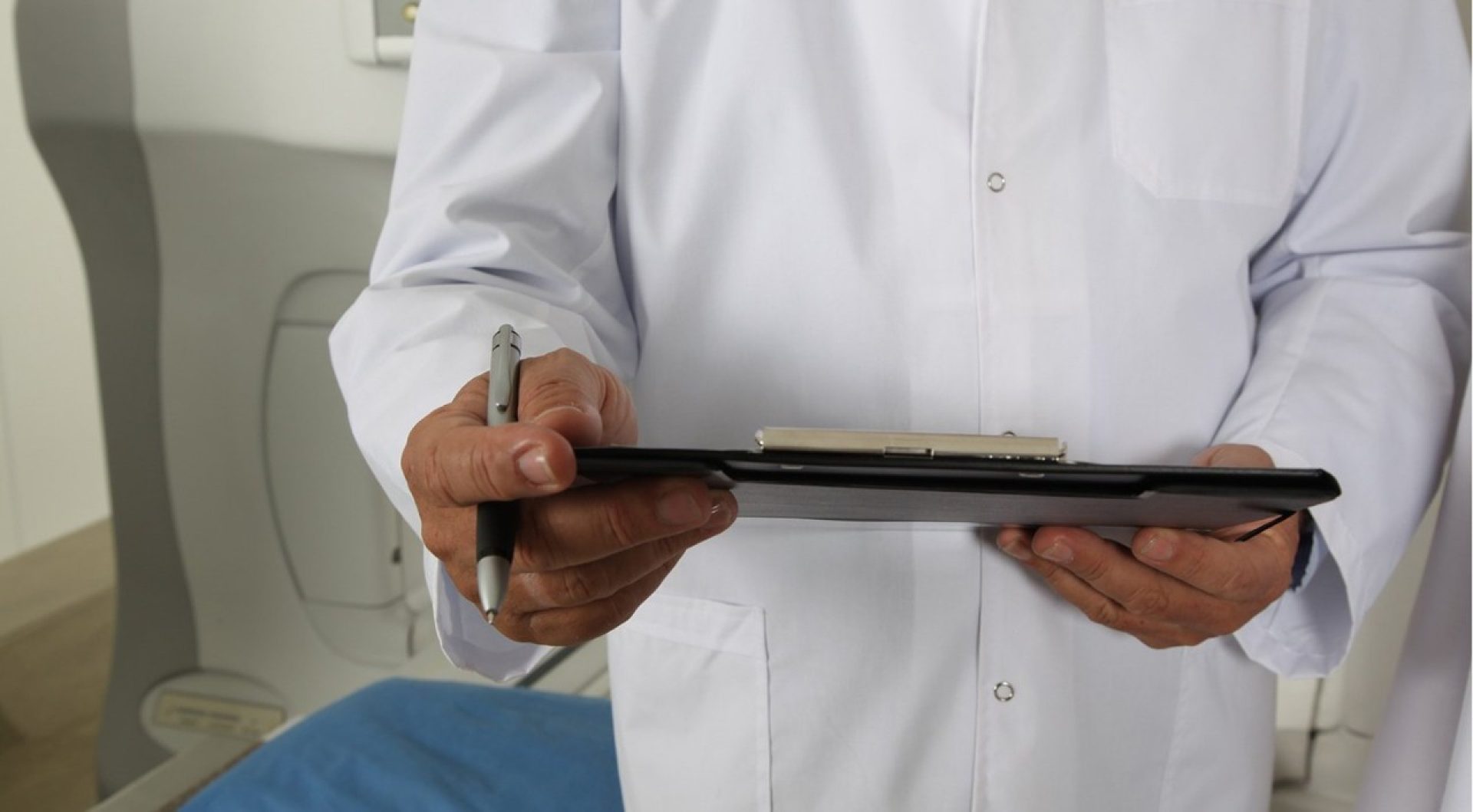 A doctor holding a clipboard