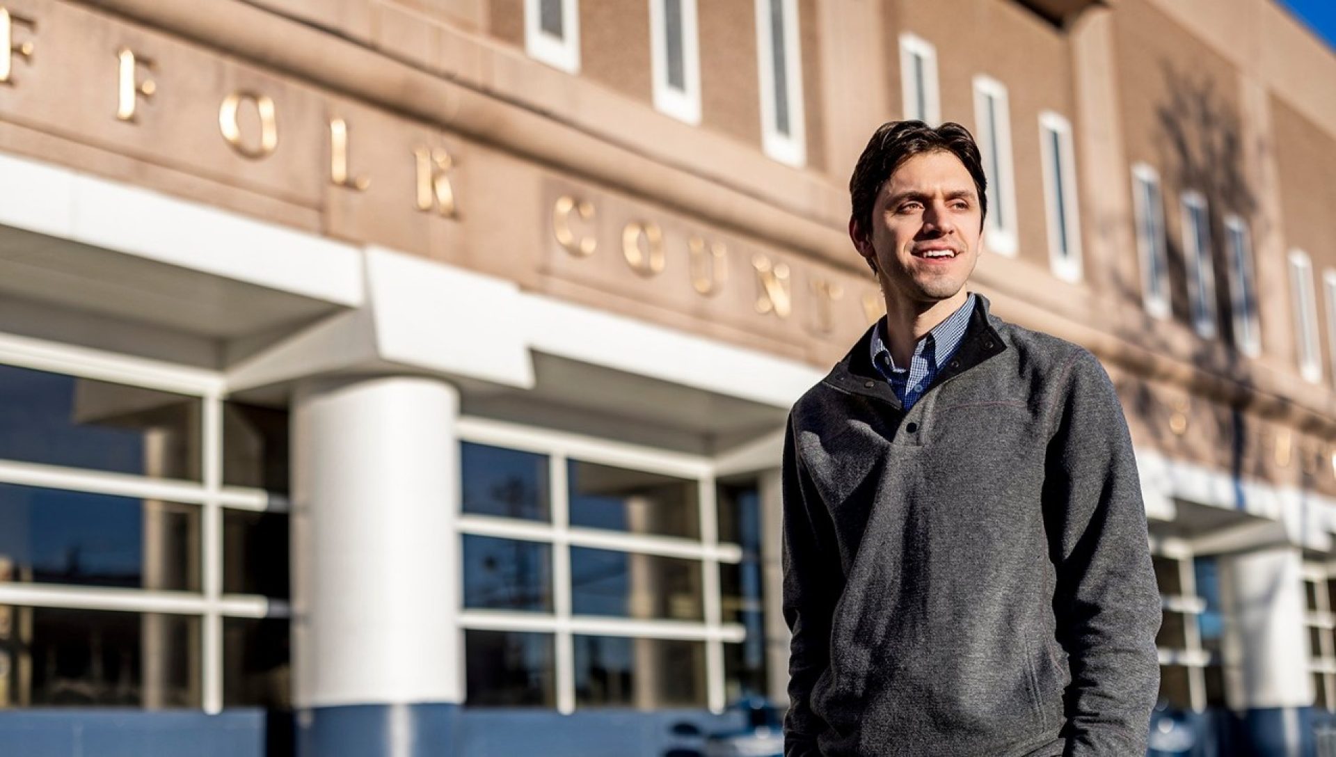 Matt DelSesto standing in front of the Suffolk County House of Correction