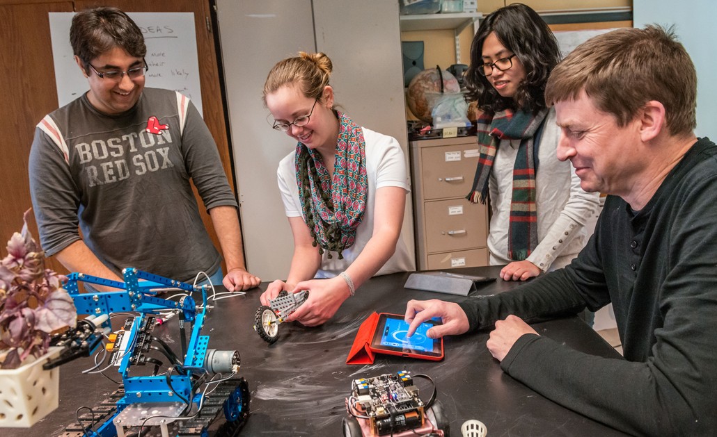 Michael Barnett working with students on a robotics project | Photo by Gary Gilbert Michael Barnett working with students on a robotics project | Photo by Gary Gilbert