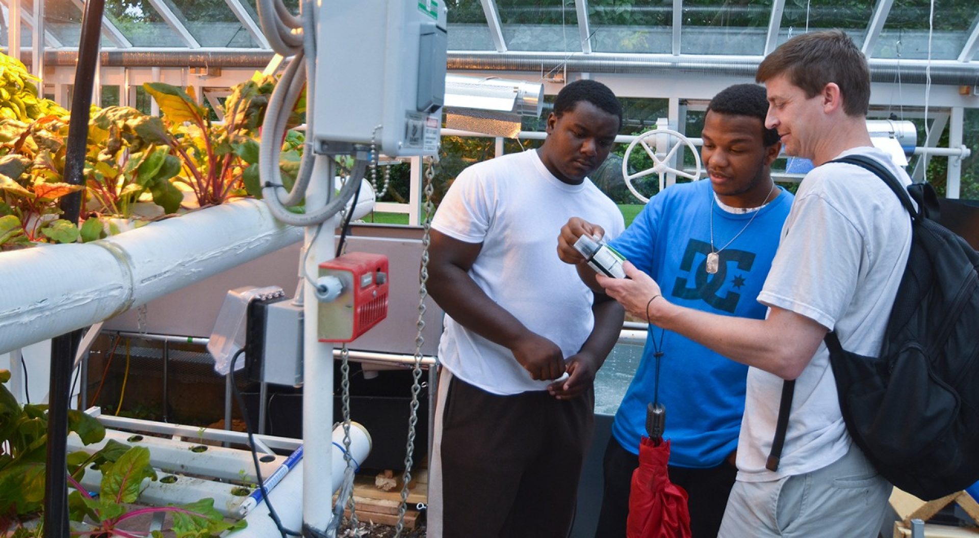 Boston College Professor of Science Education Mike Barnett (r) and colleagues report a number of positive results for students who participated in an afterschool science enrichment curriculum they developed using hydroponic gardening techniques. 