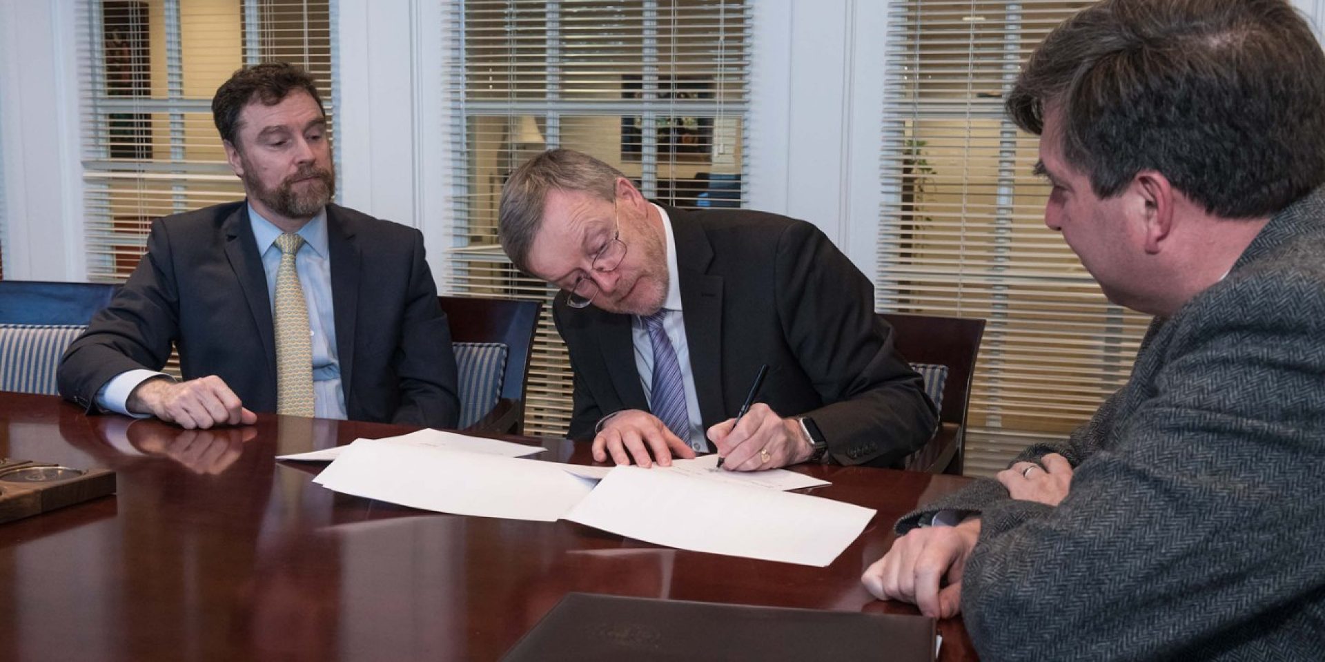 Stanton E.F. Wortham, the Charles F. Donovan, S.J. dean of BC's Lynch School of Education, MIC Professor Eugene Wall and BC Provost and Dean of Faculties David Quigley at the signing of the five-year, renewable agreement.