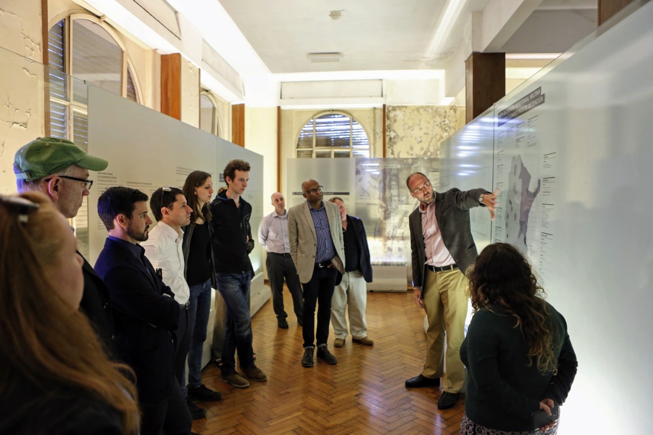 Associate Professor of Sociology Gustavo Morello, S.J., discusses the history of Argentina's brutal military dictatorship during a tour of the memorial museum known as "Ex-ESMA."
