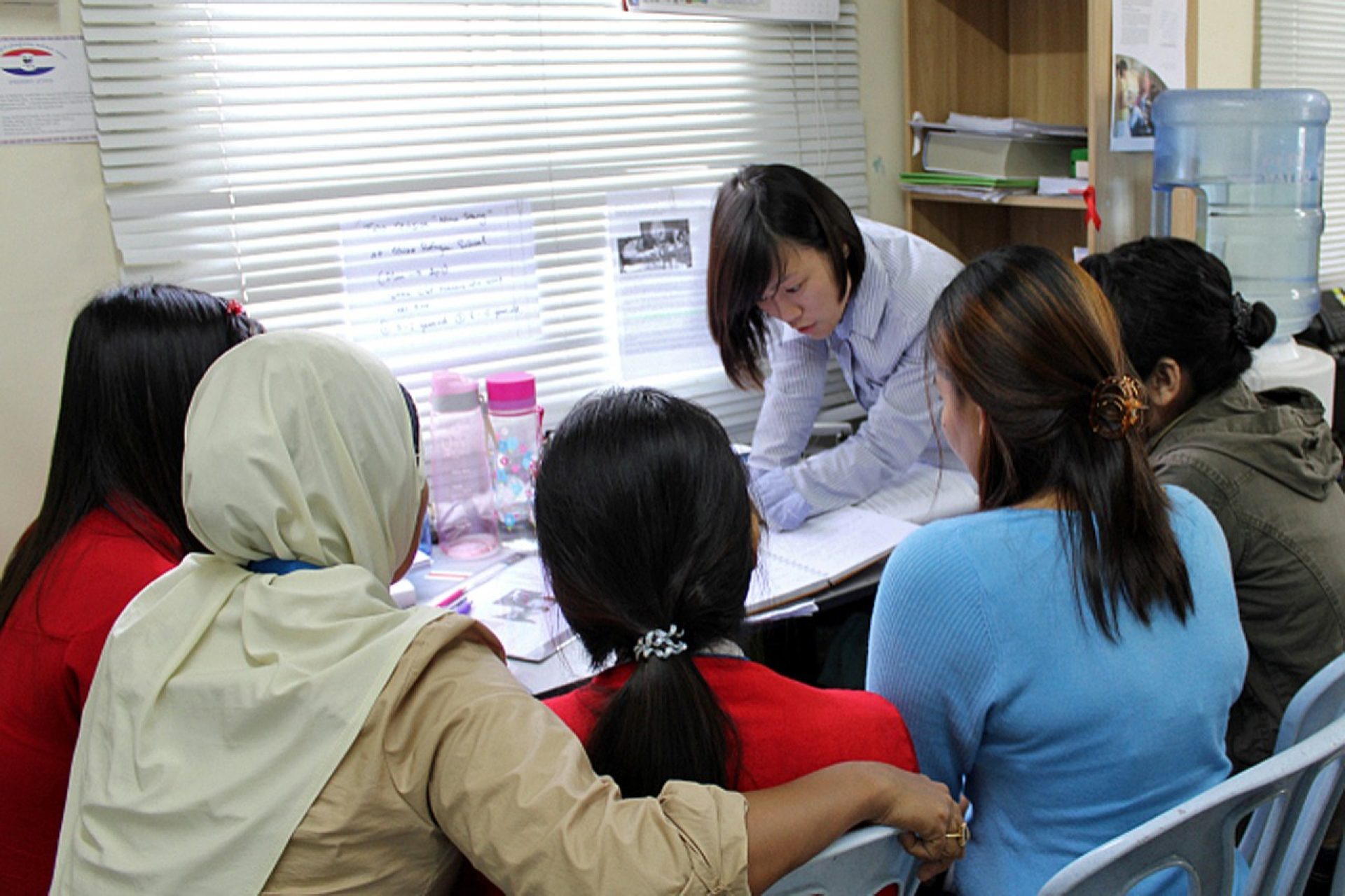 Volunteers joining the Refugee Women’s Protection Corps are trained and coached by Jackie Loo, Head of ICMC’s Office in Malaysia. The group is learning about ICMC Children’s Safety Program. The Refugee Women’s Protection Corps was one of 64 projects featured in the report. Photo courtesy of ICMC and the Boston College School of Social Work.