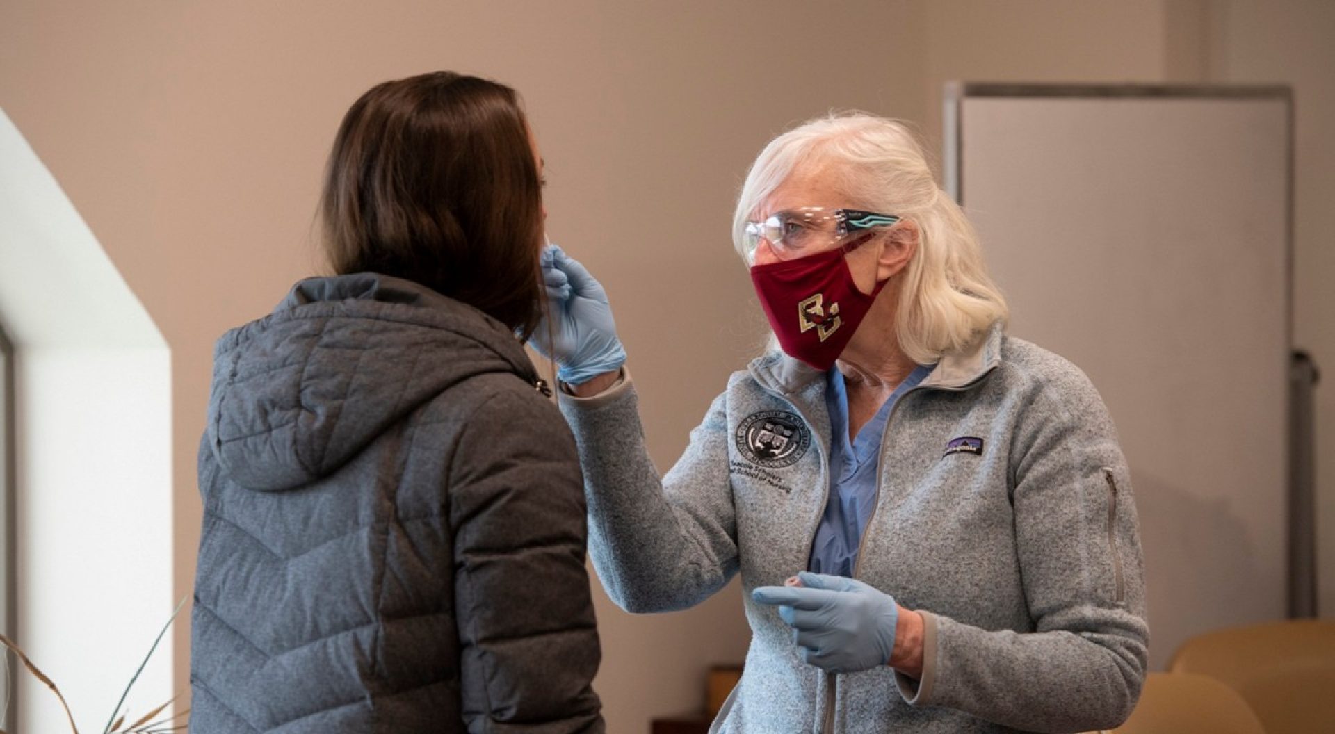 Colleen Simonelli performs COVID test