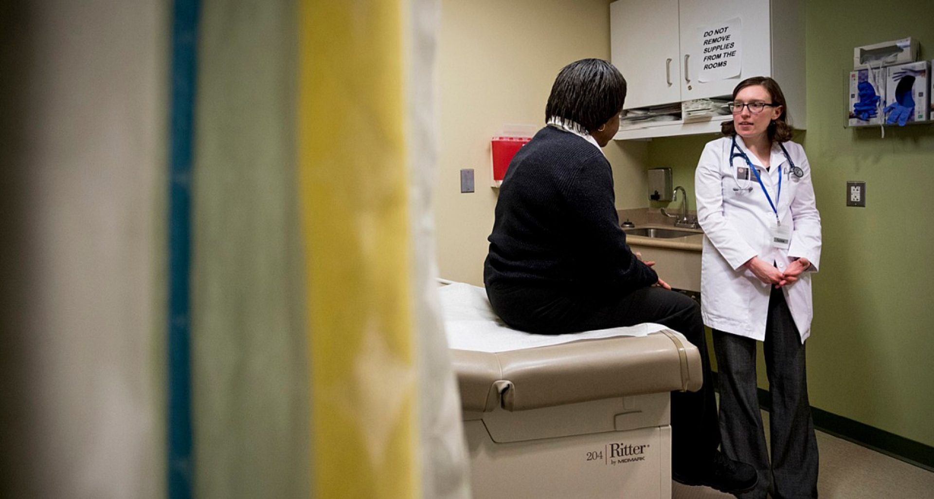 a nursing student with a patient in a clinical setting