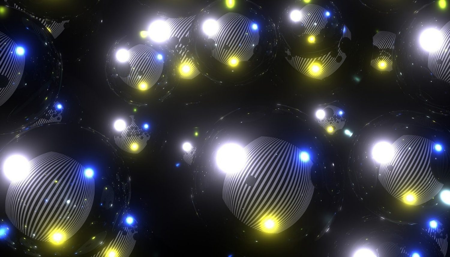 An abstract image with white, blue, and yellow lights against a black background