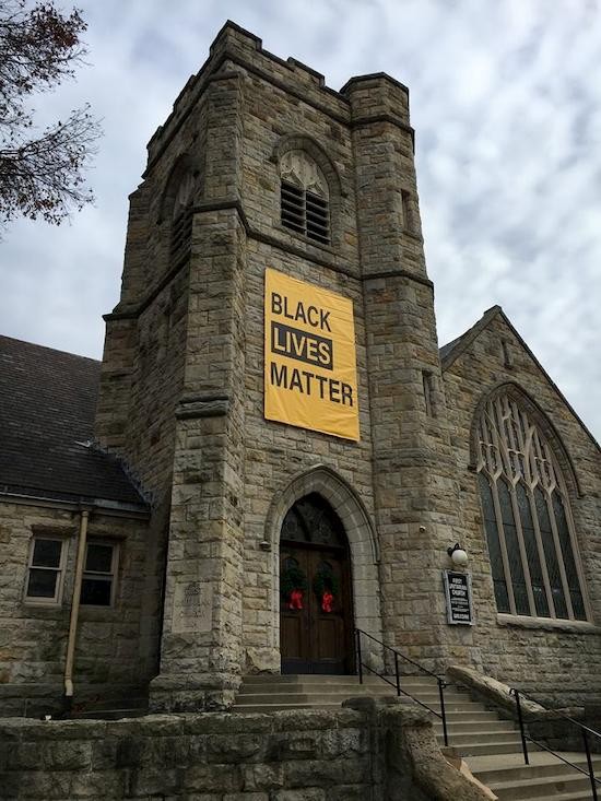 black lives banner on building