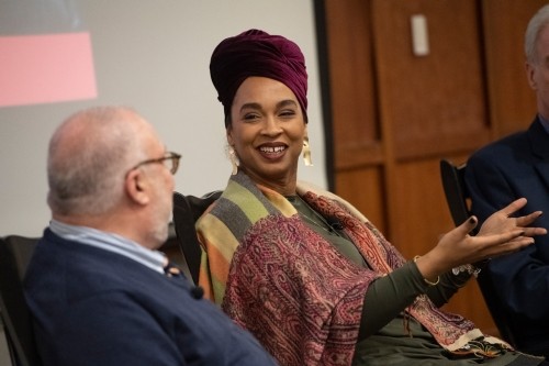 Amey Victoria Adkins-Jones gestures at Mark Massa, S.J.