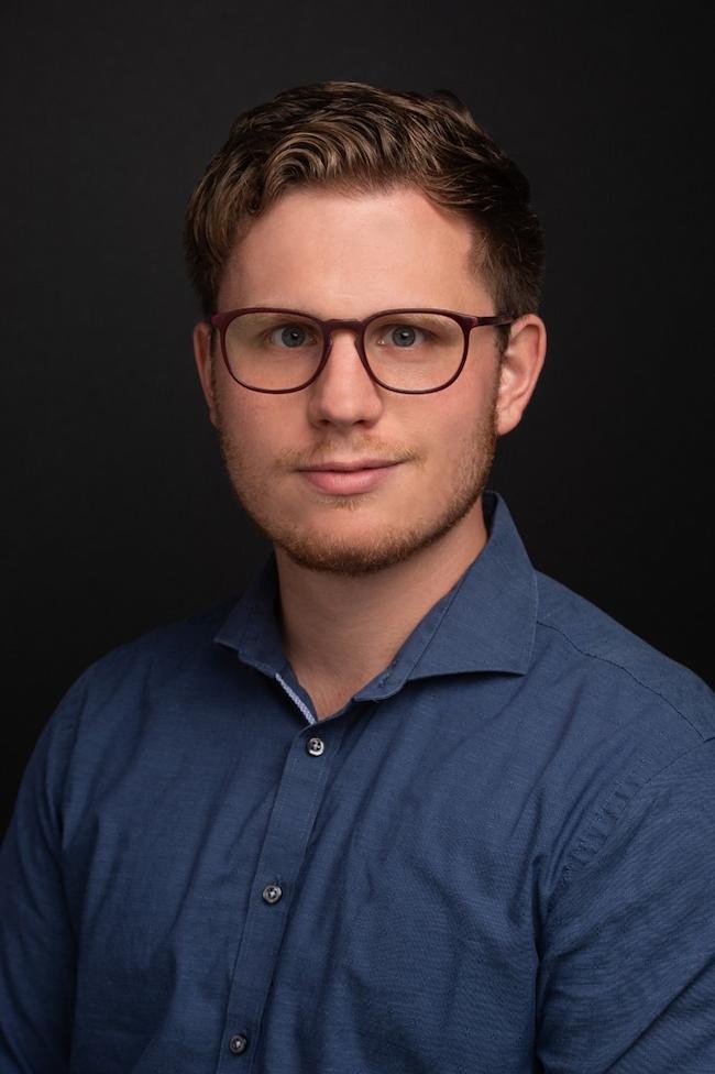 headshot of Domenik Ackermann