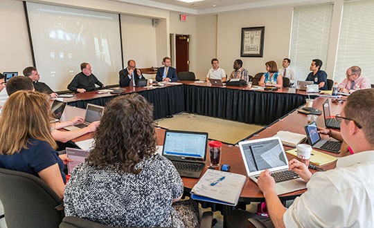 Students discussing around a table