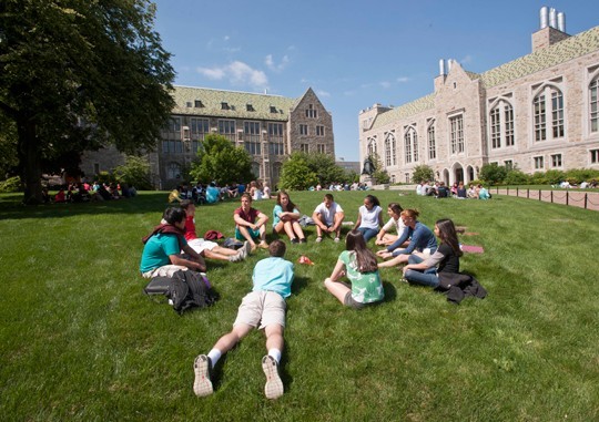 Students laying on the lawn