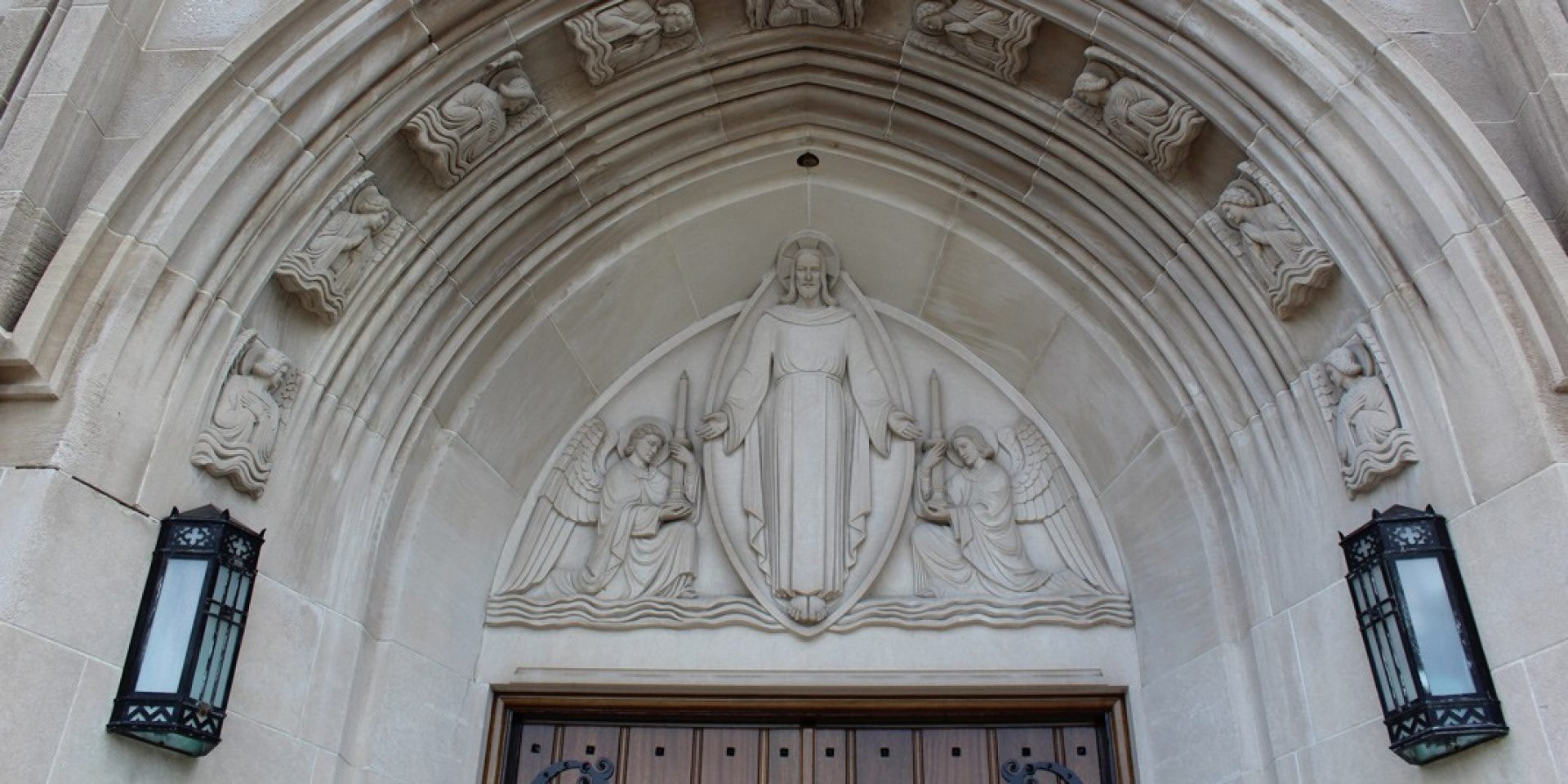 a wall with three large stained glass windows