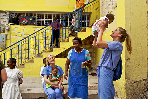 Students working with children on an international trip