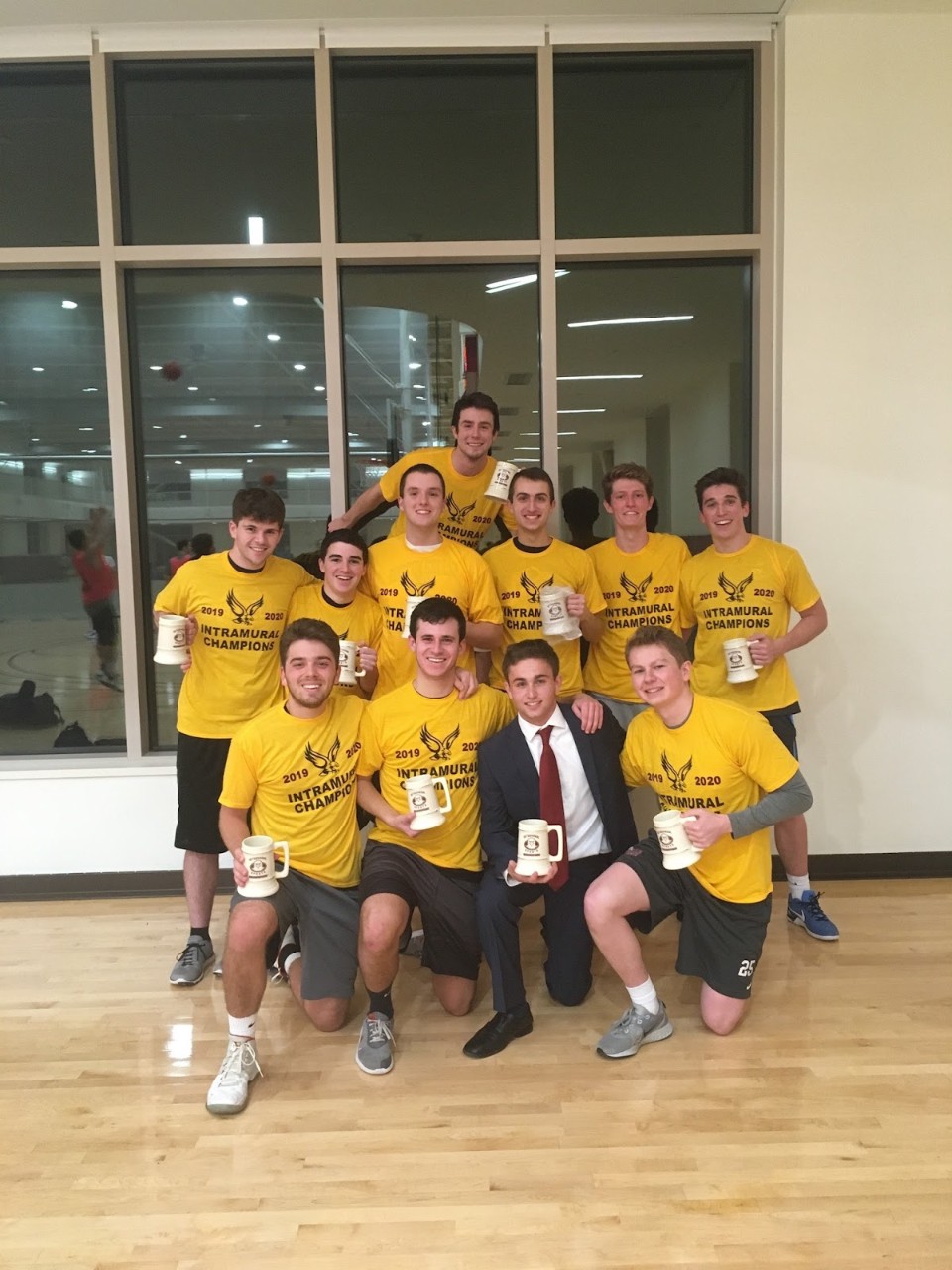 Christian Guma poses with fellow members of the Boston College Intramural Program