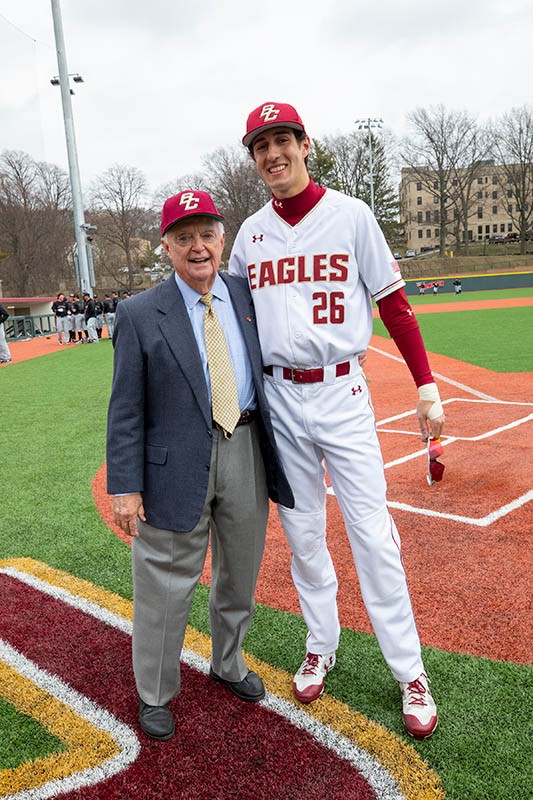 John Harrington posing with BC Eagles player.