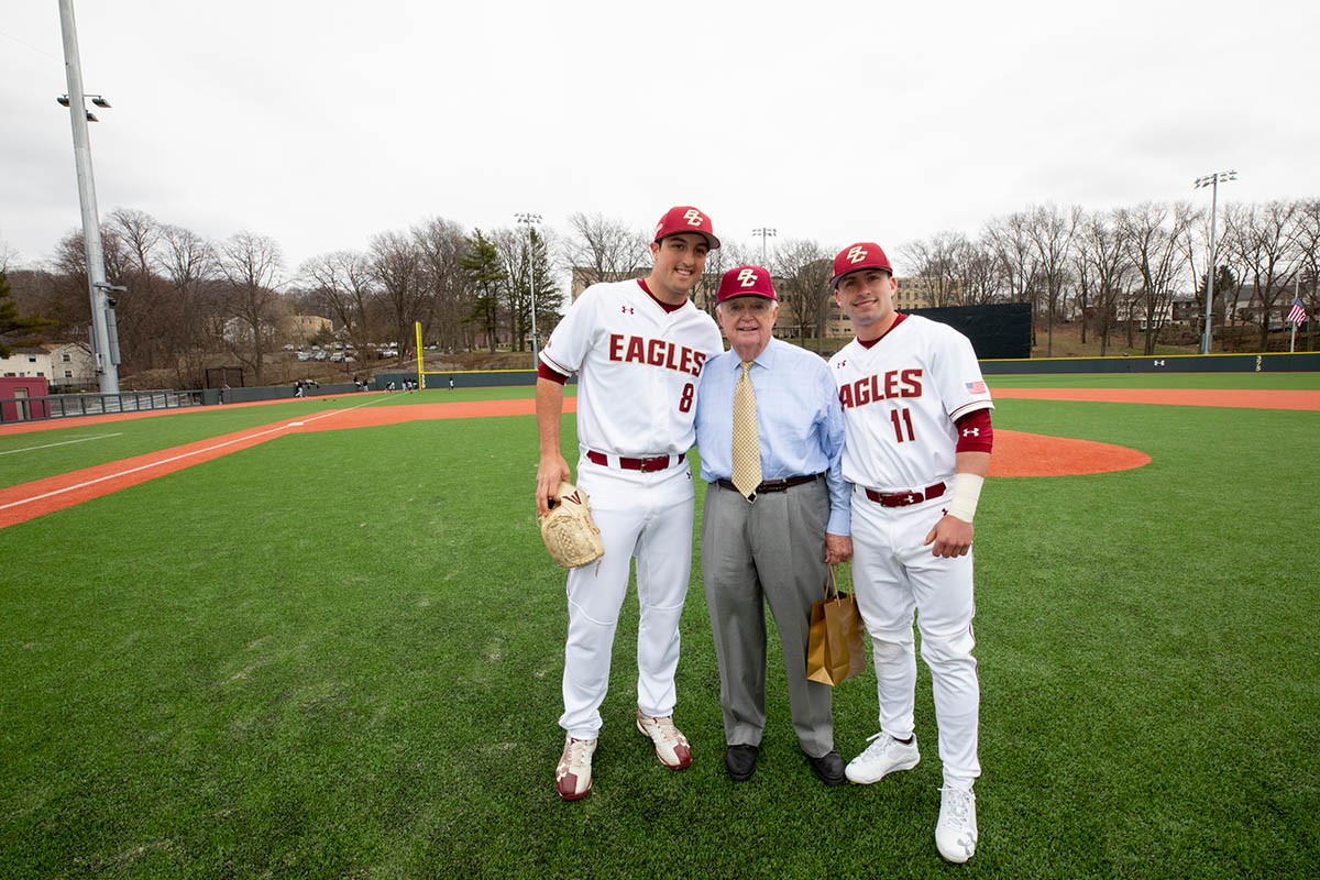 John Harrington and two BC Eagles pose.