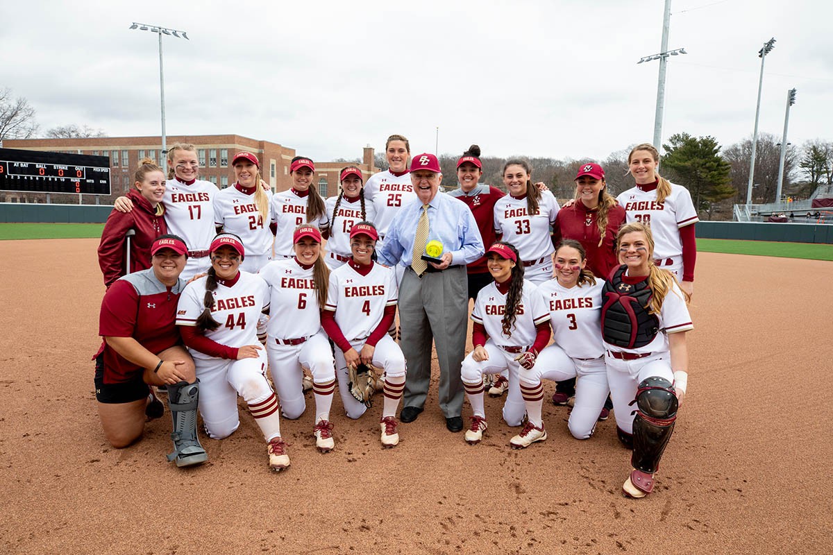 John Harrington poses with Womens team.