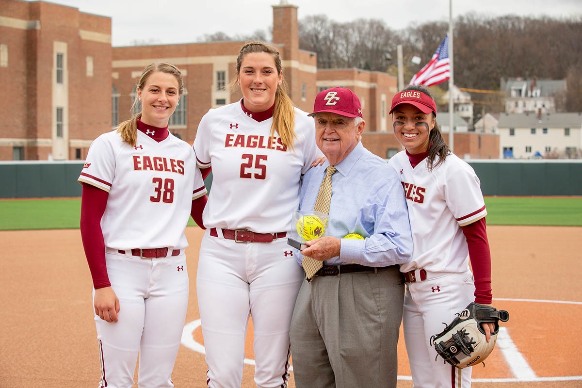 team members pose with John Harrington.