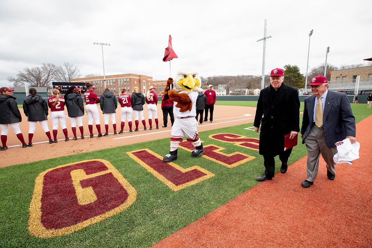 BC Eagles mascot walking with a flag.