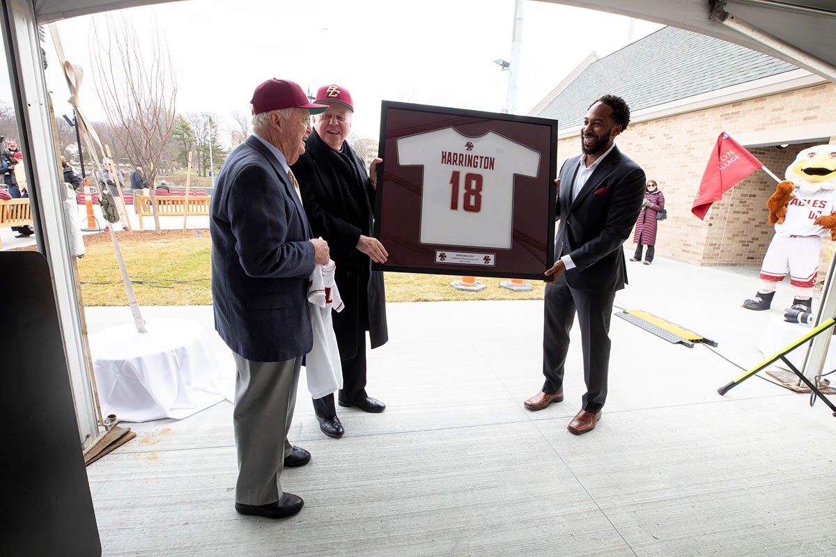 Martin Jarmond presents a framed jersey to John Harrington