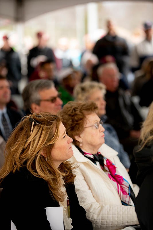crowd listening to a speech being given