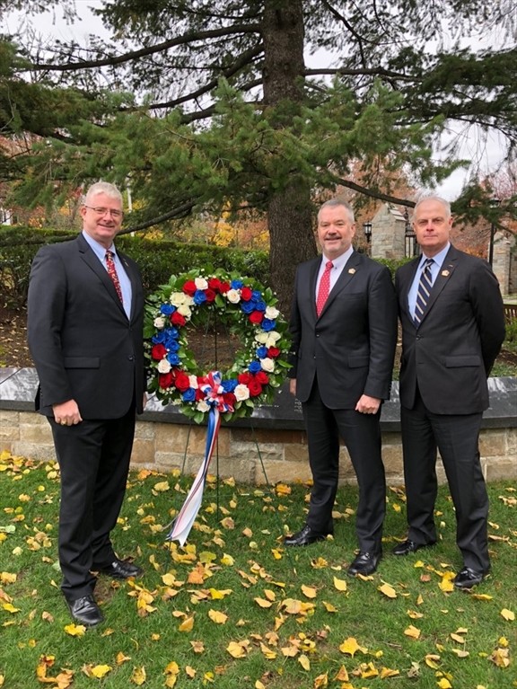 veterans by a wreath