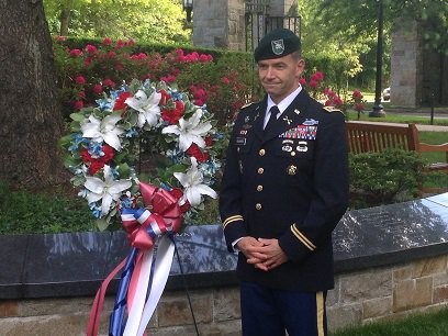 Speaker by a wreath