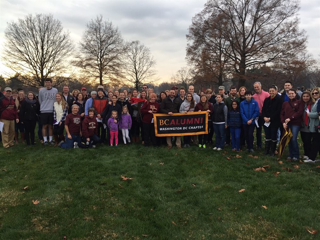 group standing with sign