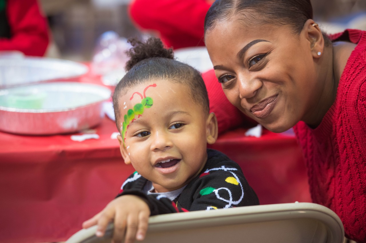 A child with their face painted