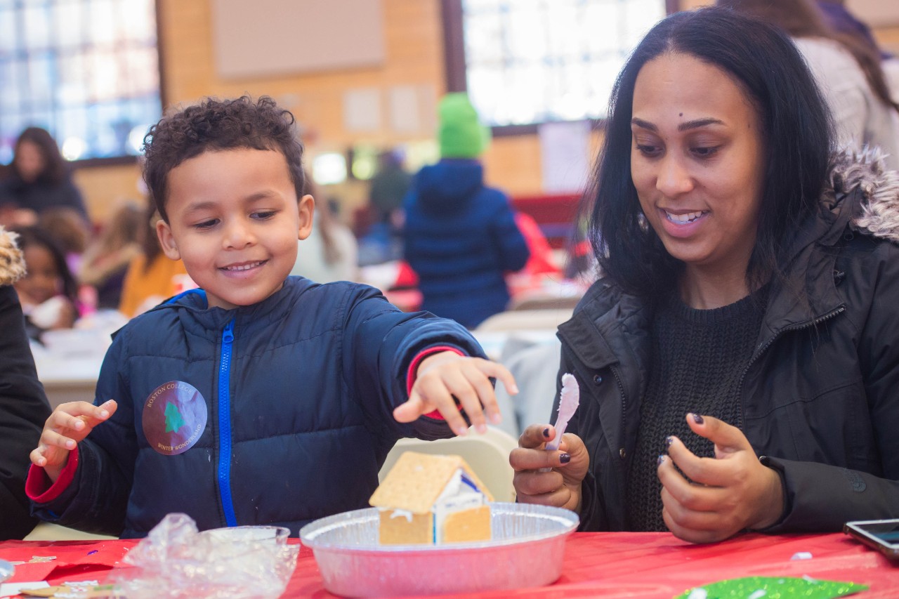 Family making gingerbread houses