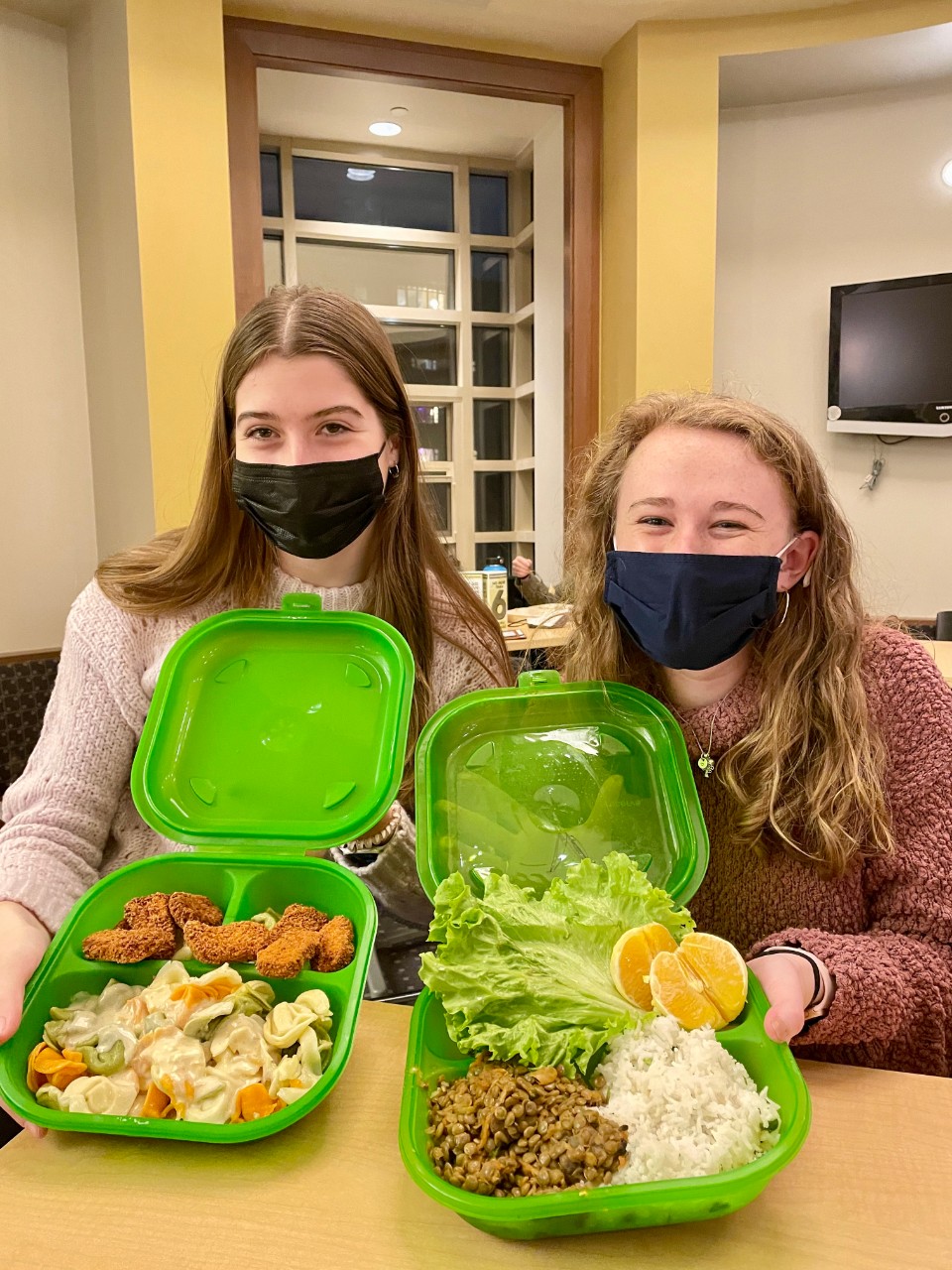 Photo of Students holding Green2Go containers
