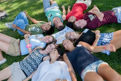 Students on lawn in summer