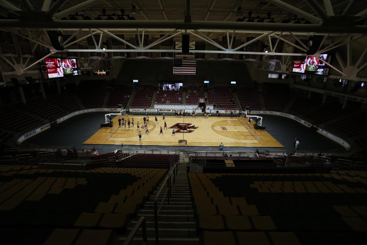 Putting the basketball floor down in Conte Forum