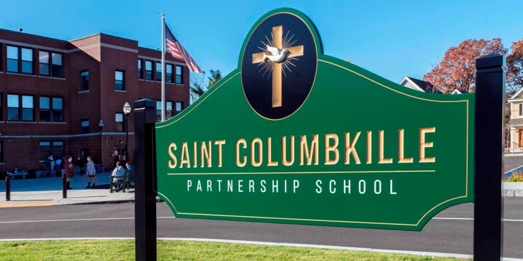 Photo of Photos taken at St. Columbkille Partnership School in Brighton, MA for a brochure. Fr. Leahy included in some photos.