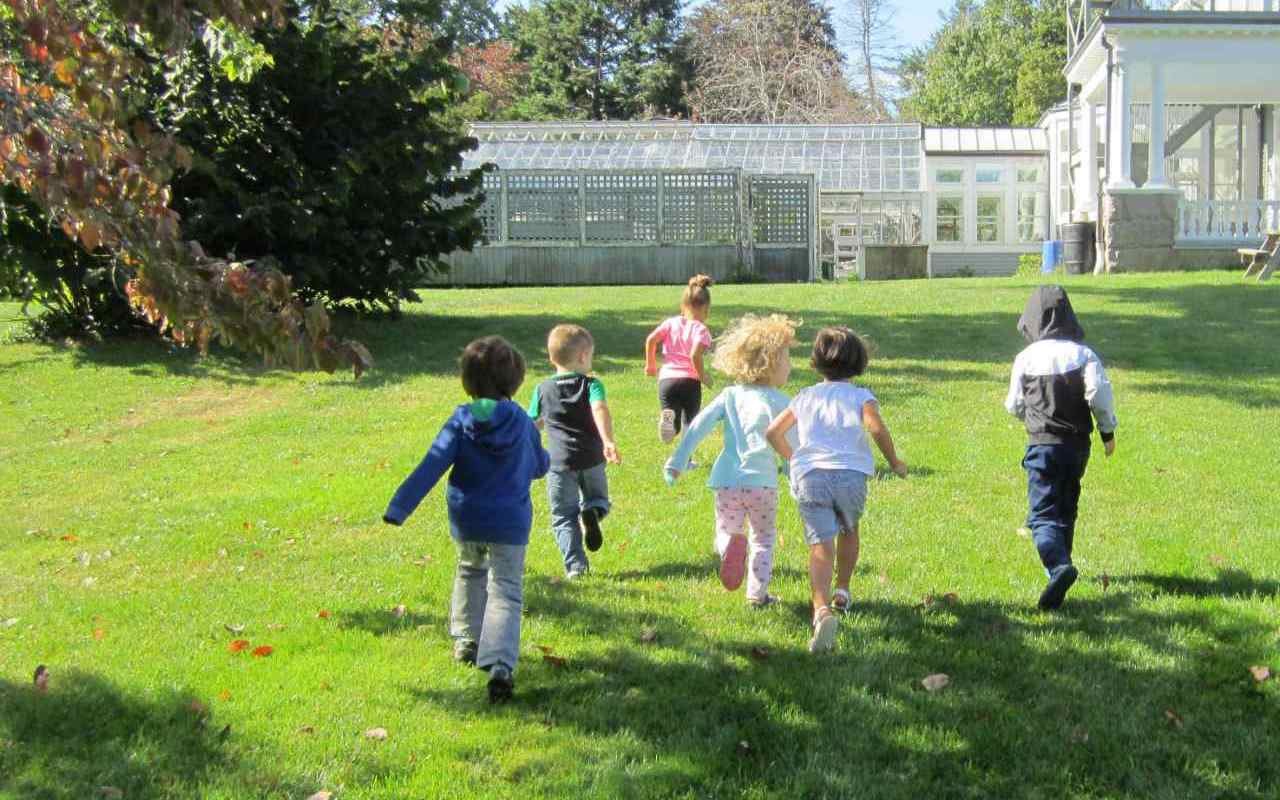children running through a field
