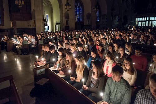 Photo of students with candles at mass
