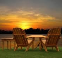 Photo of Adirondack chairs and sunset